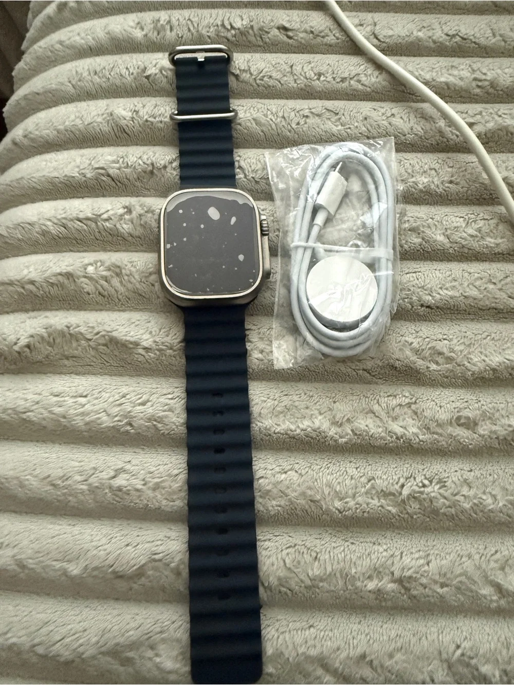Apple Watch Ultra new - refurbishedwith Navy Silicone Strap and Magnetic Charger